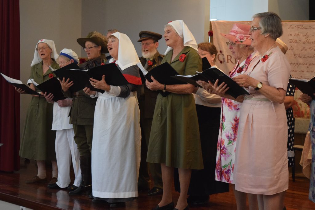 Warwick Choral Society members take to the stage for the Anzac community concert on Saturday.